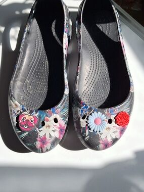 CROCS Floral Black Slip-On Flats with Colorful Charms